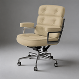 Pale yellow executive chair with three tufted back cushions, padded armrests and a silver five-star castor base.