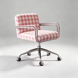 A modern office chair with pink and white gingham checkered upholstery and a polished chrome five-star base with casters, photographed on a light gray studio background.