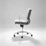 A modern office chair with a gray textured fabric seat and backrest, supported by a polished chrome five-star base with black casters, shown against a neutral light gray studio background.