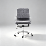 A modern office chair with a textured gray fabric upholstered seat and backrest, supported by a chrome five-star base with black casters, photographed against a seamless light gray studio background.