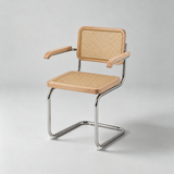 A cantilever dining chair with a light natural wood seat and backrest featuring woven cane panels, supported by a polished chrome metal frame, shown on a neutral light gray background.