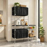 Modular storage rack with a silver-tone metal frame, black drawers, open shelves and wire baskets holding kitchen appliances and groceries.
