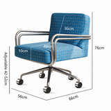 Blue upholstered office chair with a grid pattern, chrome metal frame and five-wheel base, shown with overlaid dimension labels and measurement lines on a white background.