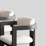 Modern Elegance: Black Frame Dining Chair with Plush Beige Upholstery and Contemporary Design