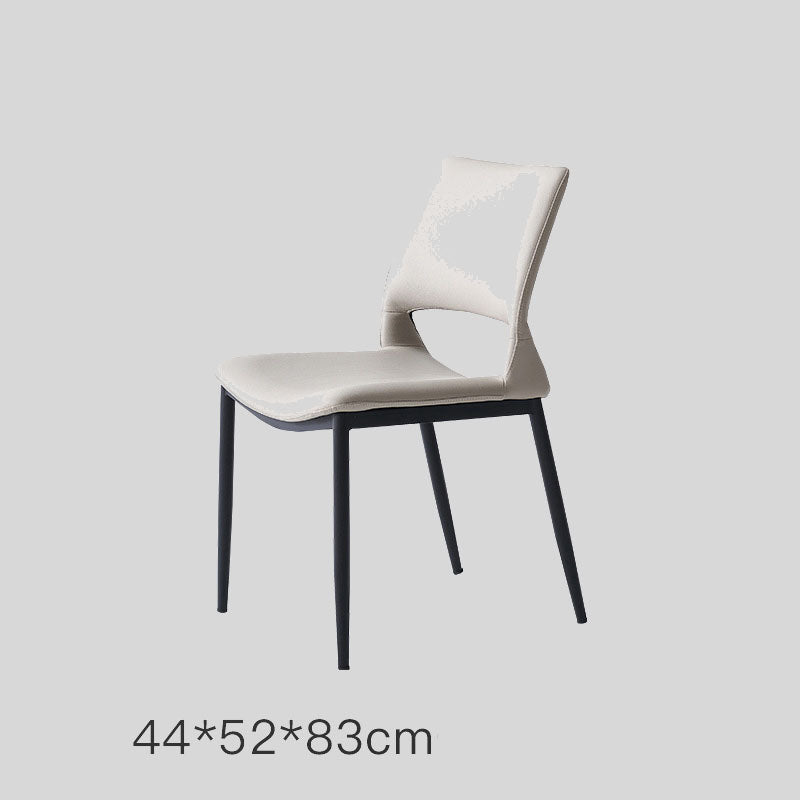 Sleek and Modern: White Leather Dining Chair with Ergonomic Design and Sturdy Black Legs