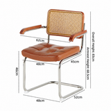 Brown faux-leather armchair with a woven cane backrest and chrome cantilever base, shown with dimension labels and dashed measurement lines on a white background.