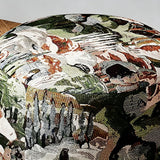A close-up of a round upholstered ottoman or pouf featuring a detailed tapestry-style print of a mountain landscape with figures, in muted green, beige, brown, black, and white tones.
