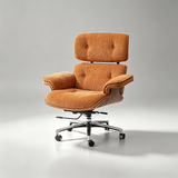 An orange upholstered lounge chair with a tufted backrest, curved armrests, and a chrome five-star rolling base, photographed on a clean light gray studio background.