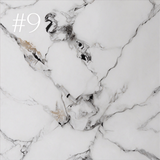 Tabletop finish sample 9 showing a white surface with bold black, grey and beige veining.