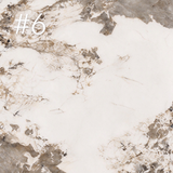Tabletop finish sample 6 showing a cream surface with broad taupe and grey patches.