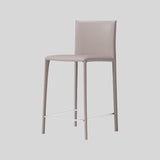 Saddle Leather Counter Stool With Steel Frame and Upholstered Legs.