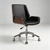 A modern office chair with black leather upholstery, wood-grain side panels, and a chrome five-star wheeled base, photographed on a light gray studio background.