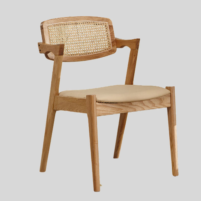 Elegant Rattan and Wood Dining Chair with Cushioned Seat