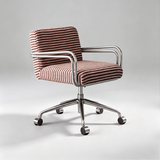 A modern office chair with a brown and beige striped fabric upholstery, chrome metal armrests and base, and black casters, photographed on a light gray studio background.