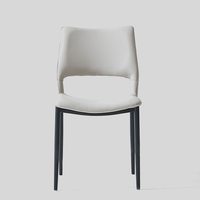 Sleek and Modern: White Leather Dining Chair with Ergonomic Design and Sturdy Black Legs