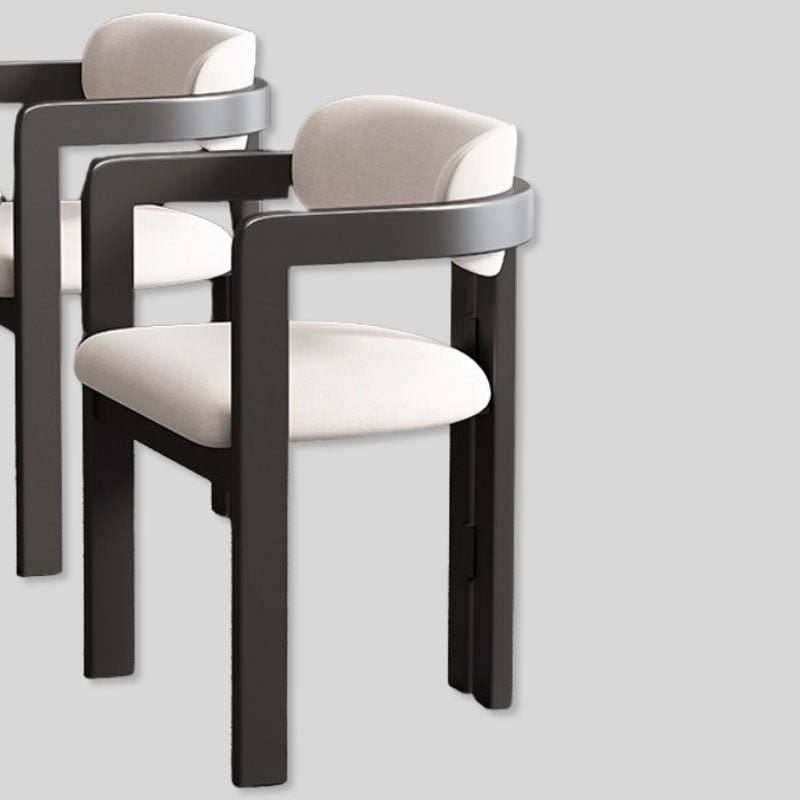 Modern Elegance: Black Frame Dining Chair with Plush Beige Upholstery and Contemporary Design