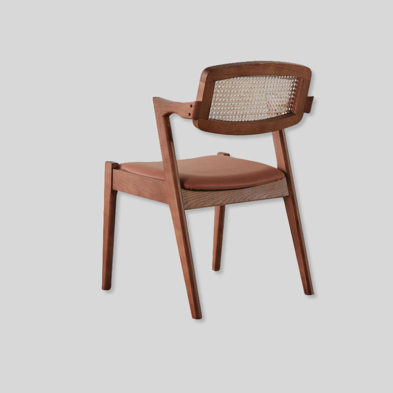 Elegant Rattan and Wood Dining Chair with Cushioned Seat