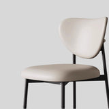 Contemporary Chic: Upholstered Ultra-fiber Leather Dining Chair with Unique Curved Back and Sleek Black Frame