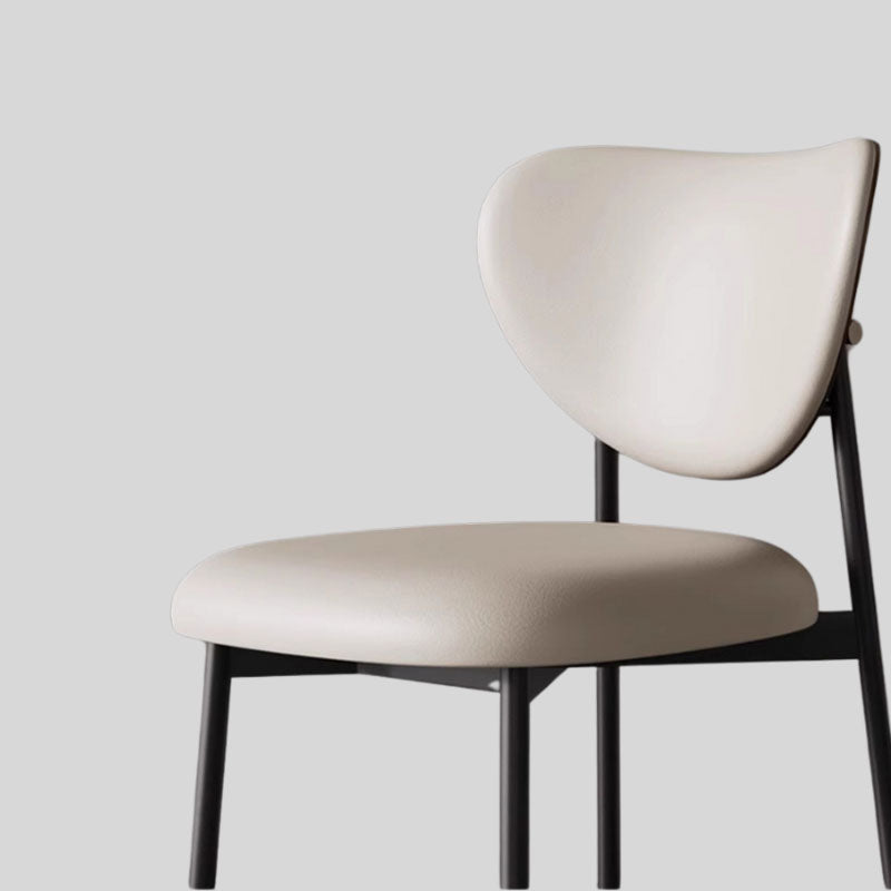 Contemporary Chic: Upholstered Ultra-fiber Leather Dining Chair with Unique Curved Back and Sleek Black Frame