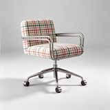 A modern office chair with a plaid upholstered seat and backrest, featuring curved chrome armrests and a five-star swivel base with casters, set against a light gray studio background.