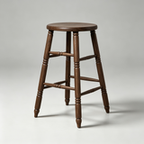 Brown wooden bar stool with a smooth round seat, turned legs and decorative horizontal stretchers, angled view.