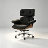 A modern lounge chair with dark gray textured fabric upholstery, a curved wooden side frame, and a chrome five-star rolling base, photographed on a light gray studio background.