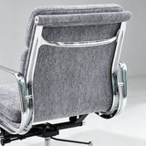 Close-up of the backrest of a modern office chair with gray textured fabric upholstery and polished chrome metal frame, shown against a light gray studio background.