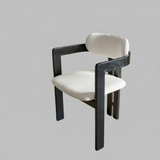 Black Frame Dining Chair with Plush Beige Upholstery and Contemporary Design