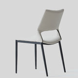 Sleek and Modern: White Leather Dining Chair with Ergonomic Design and Sturdy Black Legs