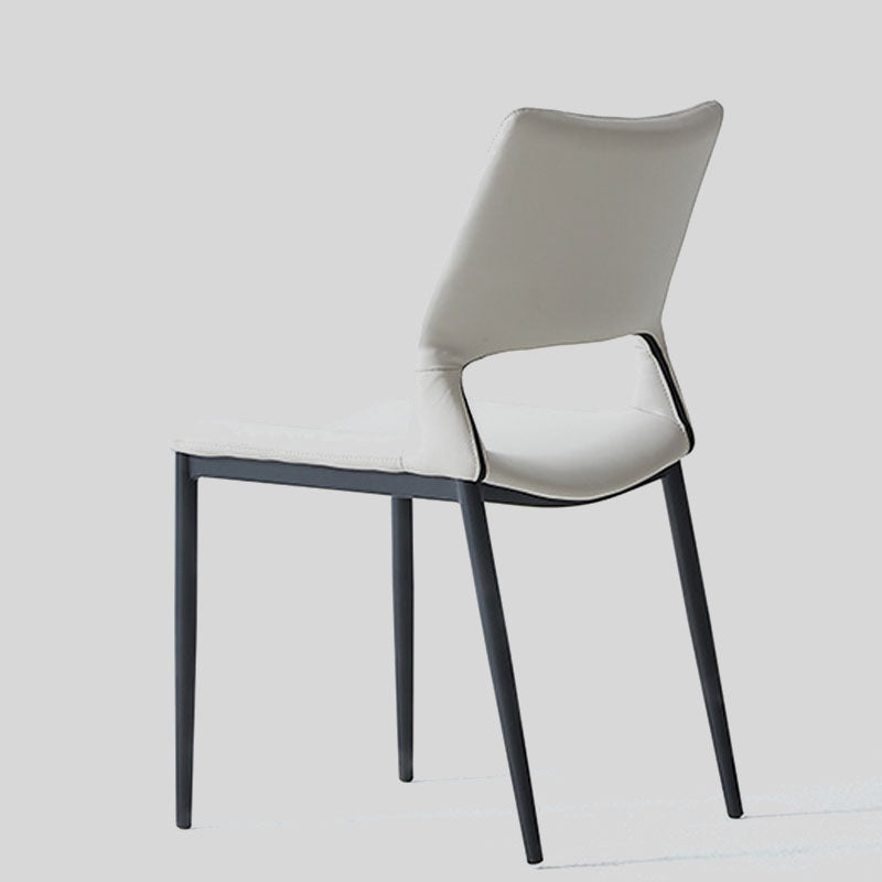 Sleek and Modern: White Leather Dining Chair with Ergonomic Design and Sturdy Black Legs