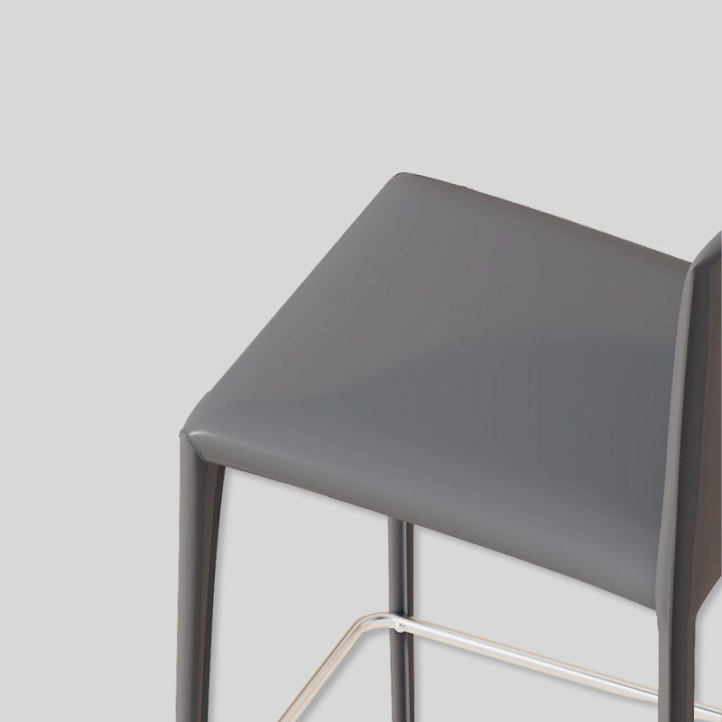 Saddle Leather Counter Stool With Steel Frame and Upholstered Legs.