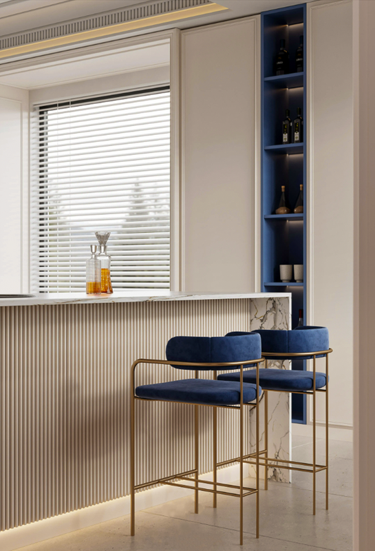 Modern kitchen with blue bar stools and a window with blinds.
