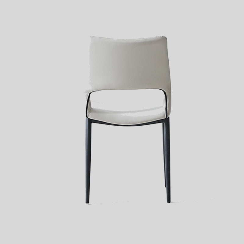 Sleek and Modern: White Leather Dining Chair with Ergonomic Design and Sturdy Black Legs