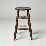 Front view of a brown wooden bar stool with a round seat, turned legs and two levels of decorative crossbars.

