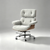 A modern lounge chair with a light gray textured fabric upholstery, a tufted headrest and backrest, curved wooden armrests, and a chrome five-star wheeled base, photographed on a neutral gray studio background.