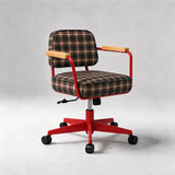 A modern office chair with a red metal frame, black casters, light wood armrests, and a brown and beige plaid fabric seat and backrest, shown against a neutral gray background.