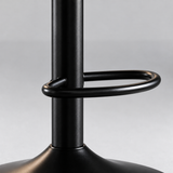 Close-up of the black oval footrest attached to the central pedestal above the flared circular base.