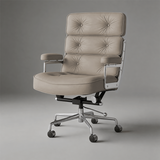 Light greige executive chair with three tufted back cushions, silver arm supports and a five-star castor base.