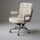 Ivory executive chair with three tufted back cushions, padded armrests and a silver five-star base with castors.