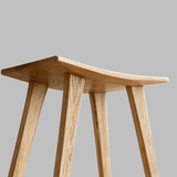 Solid Wood Saddle Bar Stool | Woven or Upholstered Seat | 65–75cm - StoolTopia