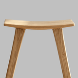Solid Wood Saddle Bar Stool | Woven or Upholstered Seat | 65–75cm - StoolTopia